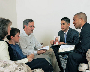 Mormon missionaries teaching in the home