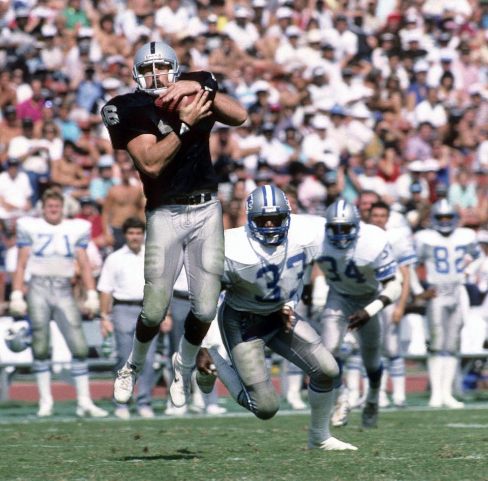 Todd Christensen catches a pass for the Raiders.